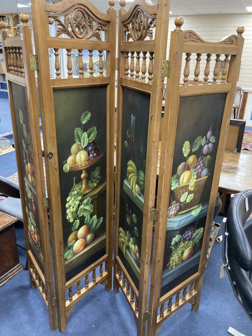 A four fold dressing screen, inset painted panels of fruit, each panel width 45cm height 185cm